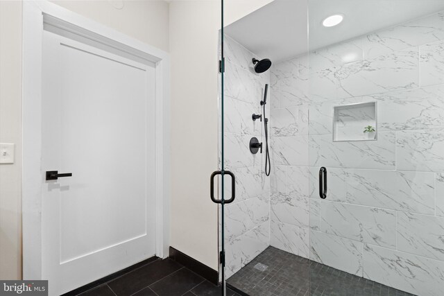 full bathroom featuring recessed lighting, baseboards, a stall shower, and tile patterned flooring