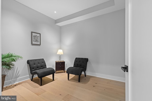 sitting room featuring recessed lighting, baseboards, and hardwood / wood-style floors