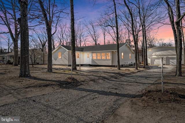 view of front of home with an outdoor structure