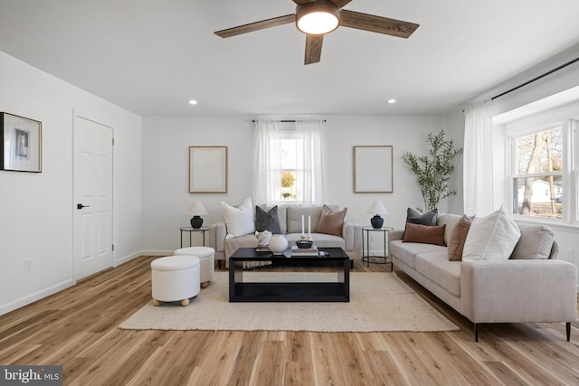 living area featuring recessed lighting, baseboards, wood finished floors, and a ceiling fan