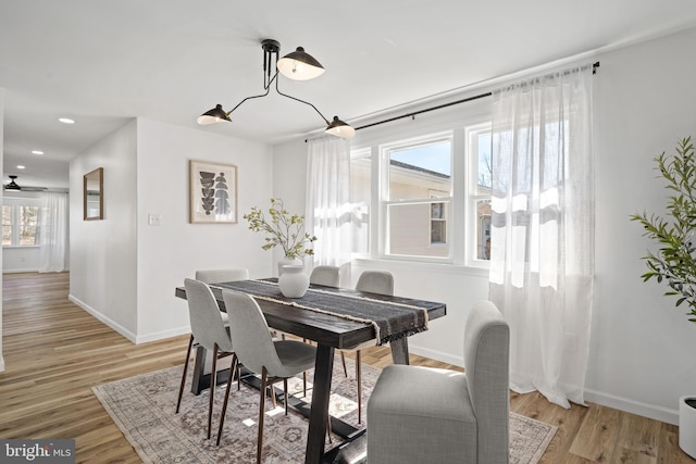 dining area featuring recessed lighting, light wood-style flooring, and baseboards