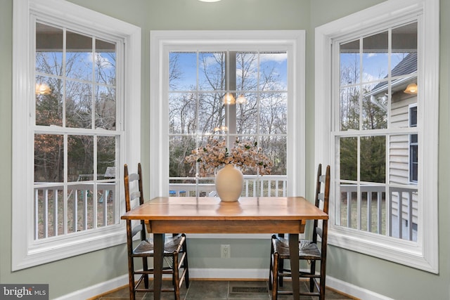 dining space featuring baseboards