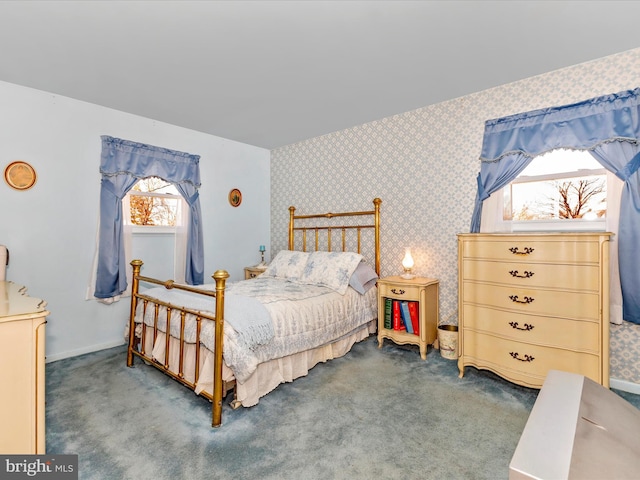 carpeted bedroom with wallpapered walls