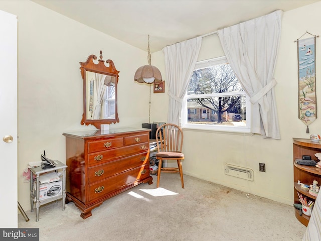 sitting room featuring baseboards and carpet