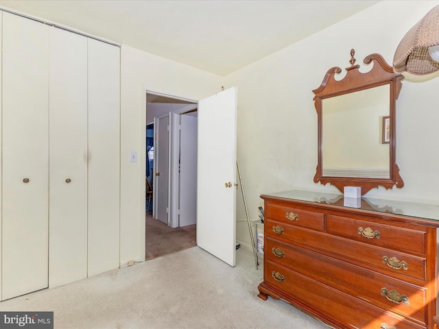 carpeted bedroom with a closet