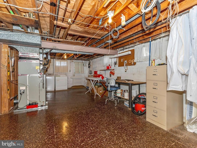 basement featuring washer and clothes dryer