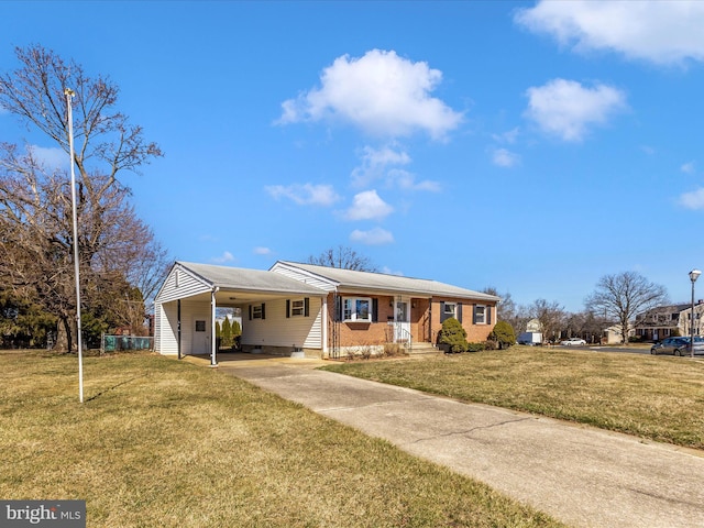 single story home with a carport, driveway, brick siding, and a front lawn