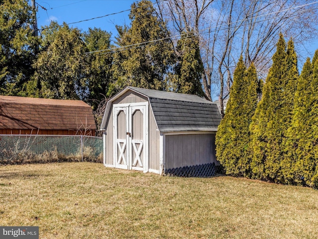 view of shed with fence