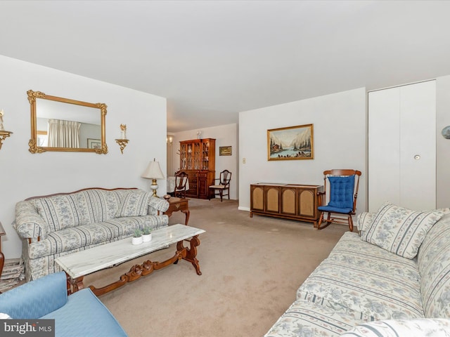 living area with light carpet