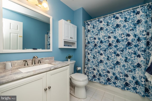 full bathroom with tile patterned floors, toilet, and vanity