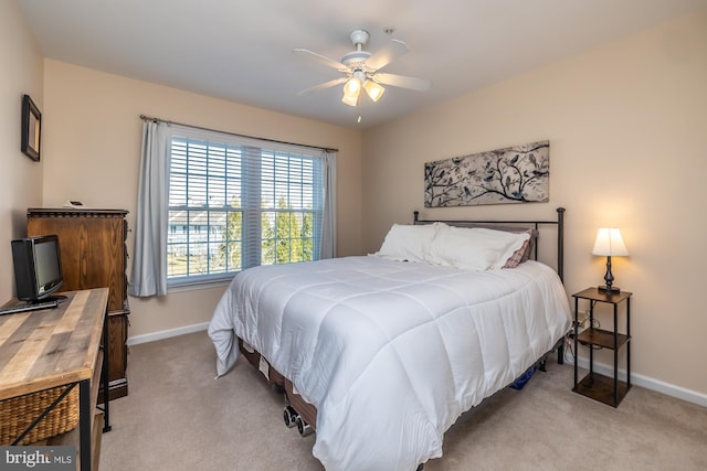 bedroom with baseboards, carpet, and a ceiling fan