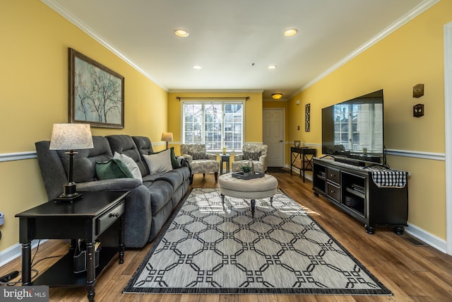 living area with recessed lighting, wood finished floors, baseboards, and ornamental molding