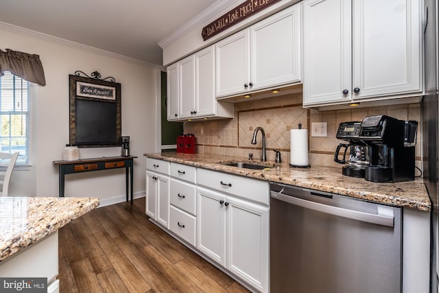 kitchen featuring white cabinetry, dark wood-style flooring, a sink, stainless steel dishwasher, and crown molding