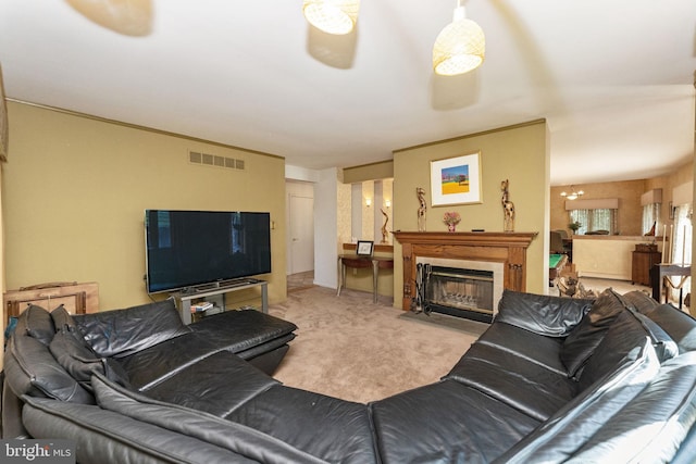 living area with carpet flooring, a fireplace, and visible vents