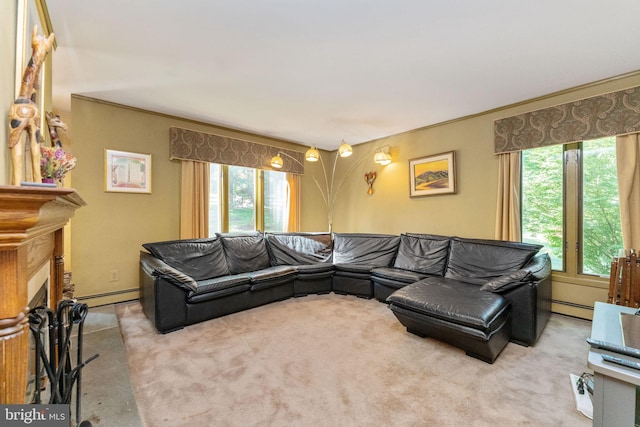 living room featuring a baseboard heating unit, carpet floors, a fireplace, and crown molding