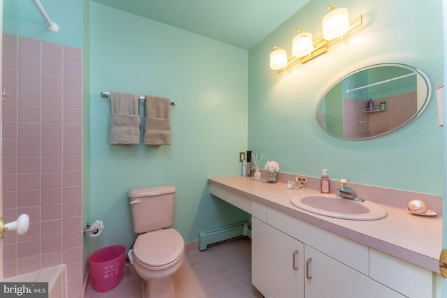 bathroom with toilet, tile patterned flooring, baseboards, baseboard heating, and vanity