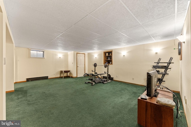 workout room with a drop ceiling, baseboards, and carpet floors