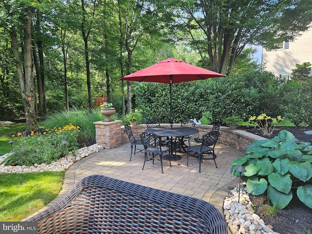 view of patio featuring outdoor dining area