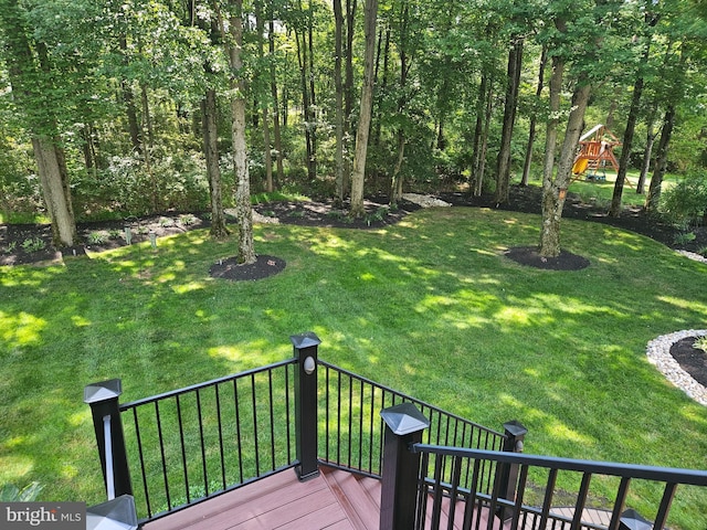 view of yard featuring a wooden deck