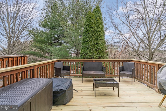 wooden deck featuring an outdoor hangout area