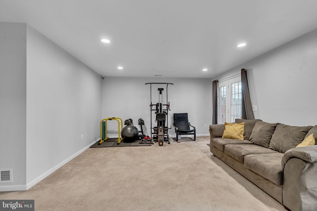 exercise room with carpet flooring, recessed lighting, visible vents, and baseboards