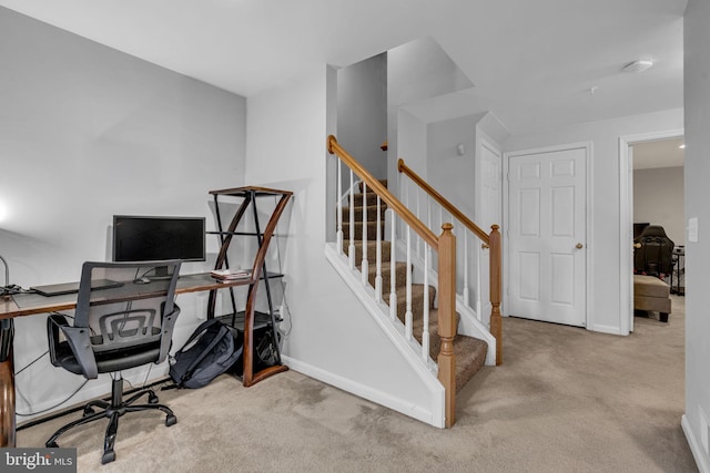 carpeted home office with baseboards