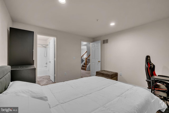 bedroom featuring visible vents, recessed lighting, ensuite bath, and baseboards