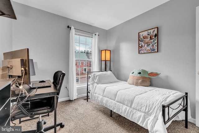 bedroom featuring baseboards and carpet floors