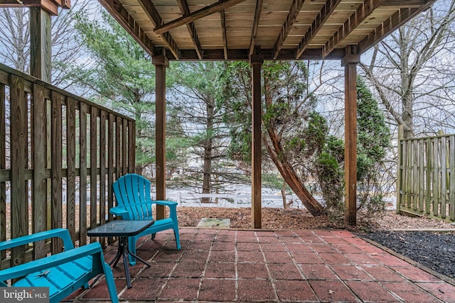 view of patio featuring fence