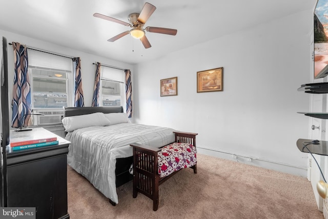 carpeted bedroom with cooling unit and ceiling fan