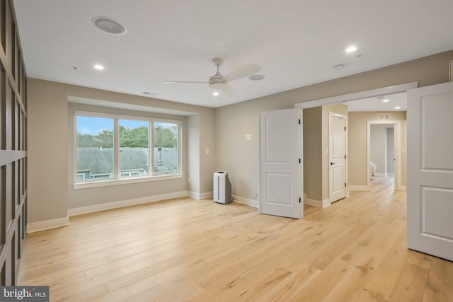 spare room featuring recessed lighting, baseboards, light wood-style floors, and ceiling fan