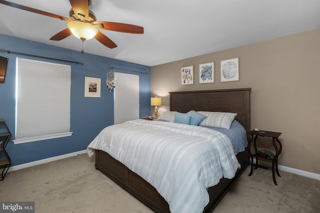 bedroom with baseboards, ceiling fan, and carpet flooring