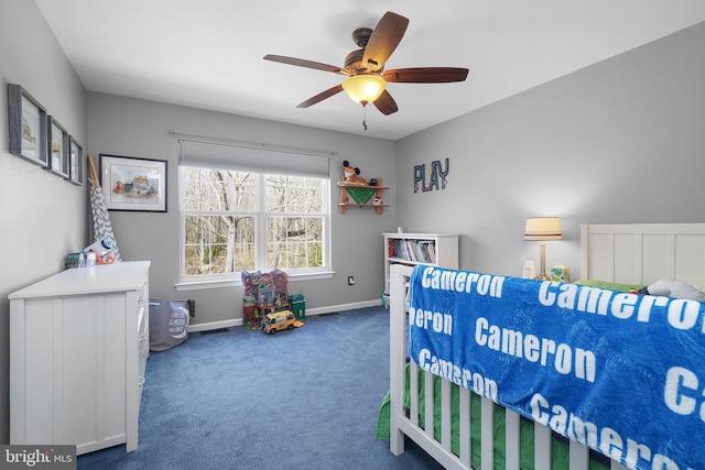 carpeted bedroom featuring baseboards and a ceiling fan