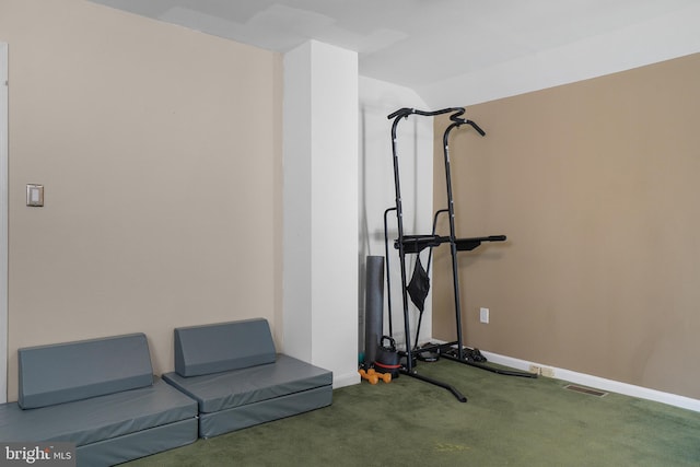 exercise area featuring carpet flooring, baseboards, lofted ceiling, and visible vents