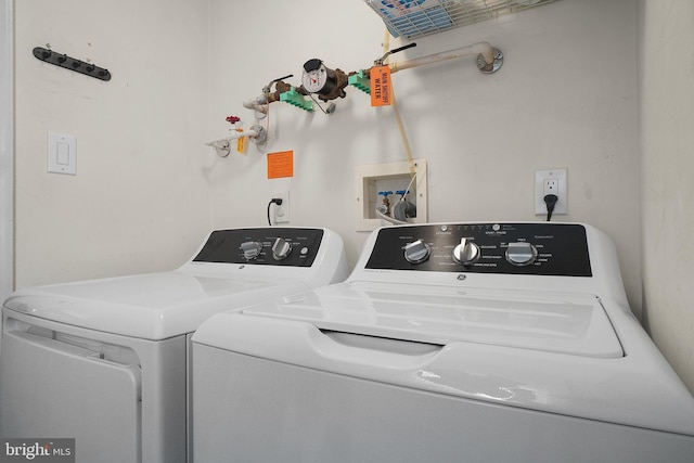 clothes washing area featuring laundry area and independent washer and dryer