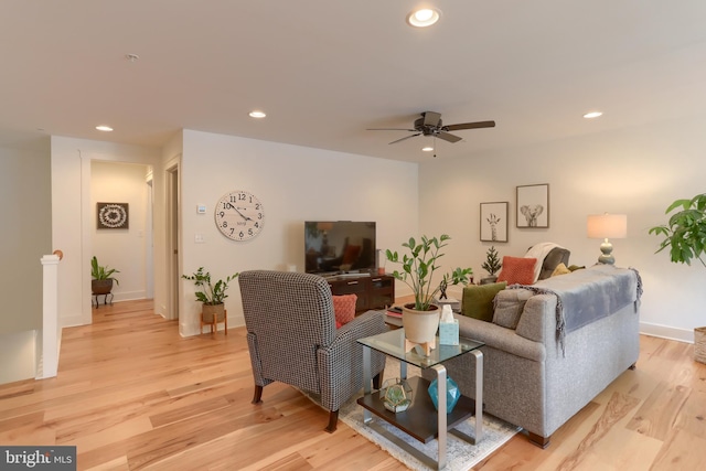 living room featuring recessed lighting, baseboards, light wood-style floors, and ceiling fan