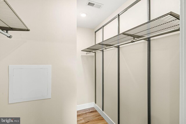 walk in closet featuring visible vents and light wood-style flooring