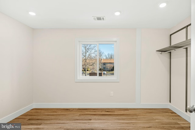 spacious closet featuring visible vents and light wood-type flooring