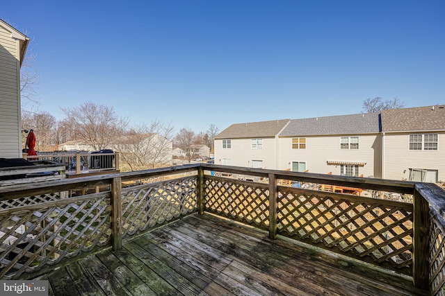 wooden terrace featuring a residential view