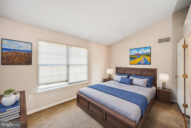 bedroom with visible vents, carpet floors, baseboards, and vaulted ceiling