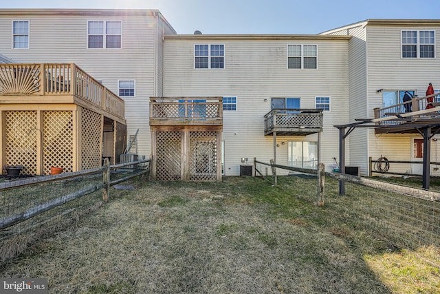 back of house with a yard, fence, cooling unit, and a wooden deck