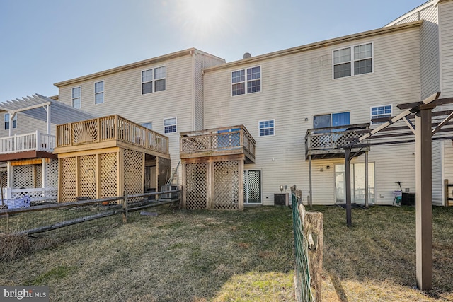 rear view of house with a wooden deck, central air condition unit, a pergola, and fence