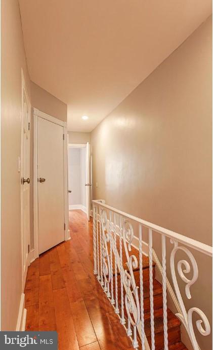 hall with light wood-style flooring