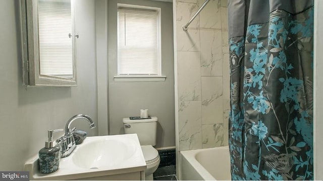 bathroom featuring toilet, vanity, and shower / tub combo