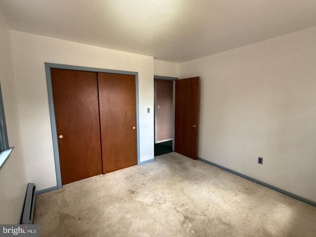 1002 N New St, West Chester, PA 19380 - unfurnished bedroom featuring light colored carpet, a closet, and baseboards