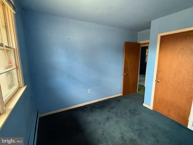 1002 N New St, West Chester, PA 19380 - unfurnished bedroom with baseboards, carpet floors, and a baseboard radiator