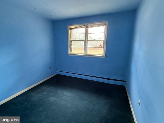 1002 N New St, West Chester, PA 19380 - spare room with baseboards and a baseboard radiator