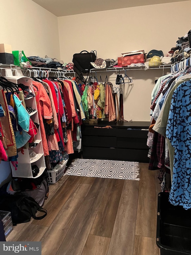 spacious closet with wood finished floors