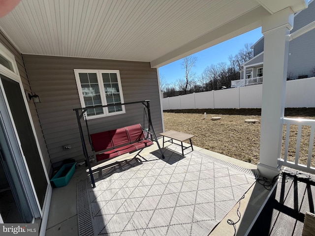 view of patio / terrace featuring fence