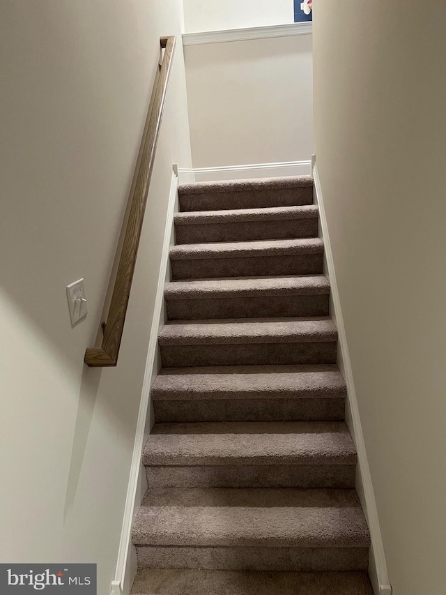 staircase with baseboards